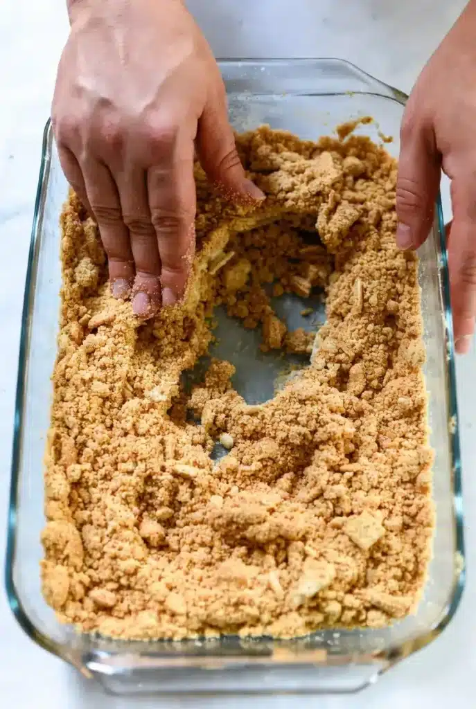 Graham cracker crust pressed evenly into a baking dish