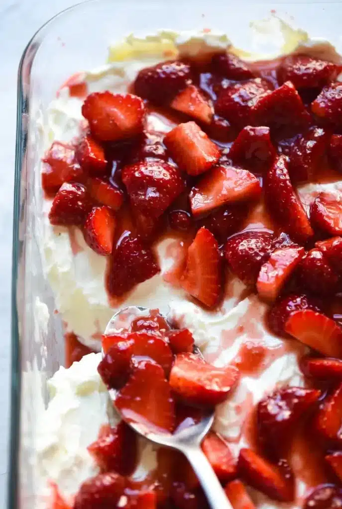 Strawberries cooking in a saucepan with sugar and thickening sauce