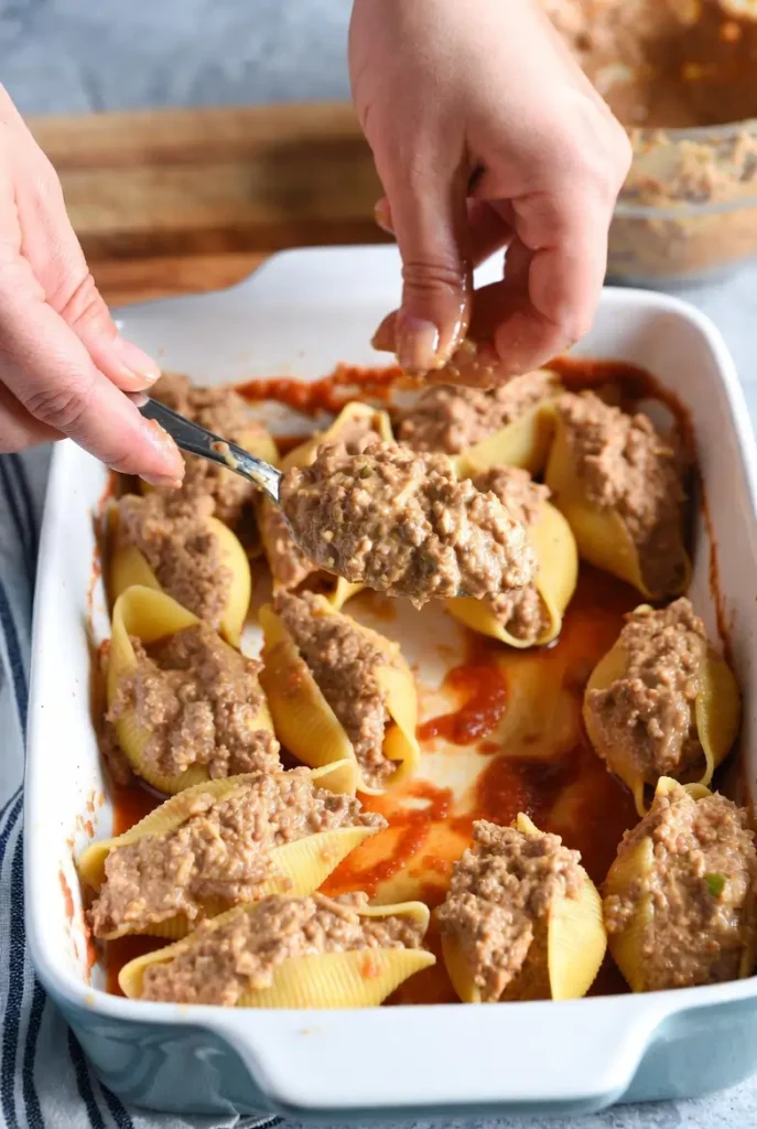 20-Min Prep: Cheesy Taco Stuffed Pasta Shells Recipe 11 filling large pasta shells with creamy beef mixture