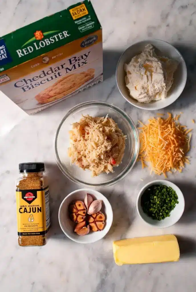 Cheesy crab garlic butter biscuits ingredients with melted cheese and crab meat