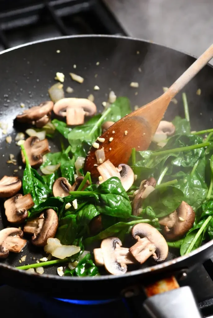 Cooking mushroom spinach mixture