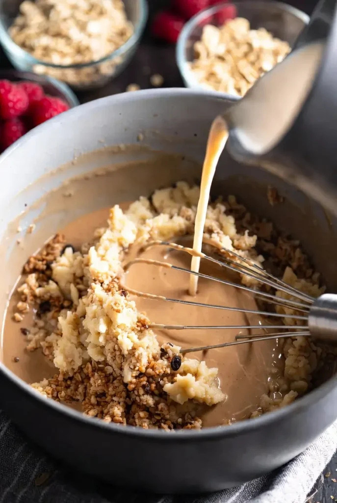 In a separate bowl, whisk together the almond milk, mashed banana, and vanilla extract.