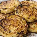 Blistered Cabbage Steaks with crispy roasted edges and tender center