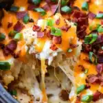 Easy Crockpot Swamp Potatoes (Creamy, Cheesy & Loaded) 14 creamy potatoes with melted cheese and crispy topping