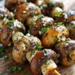 Grilled mushroom skewers brushed with garlic butter and fresh parsley